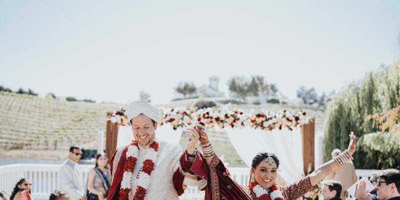 Newly married couple celebrating their vineyard wedding with all inclusive wedding services at Léal Vineyards.
