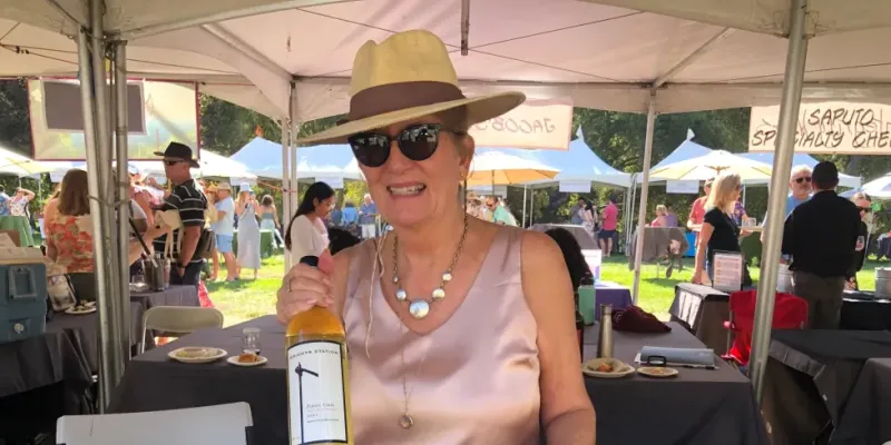 Woman holding a bottle of wine