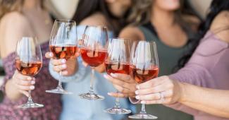 Friends enjoying rosé at a winery in Hollister CA during a relaxed tasting experience