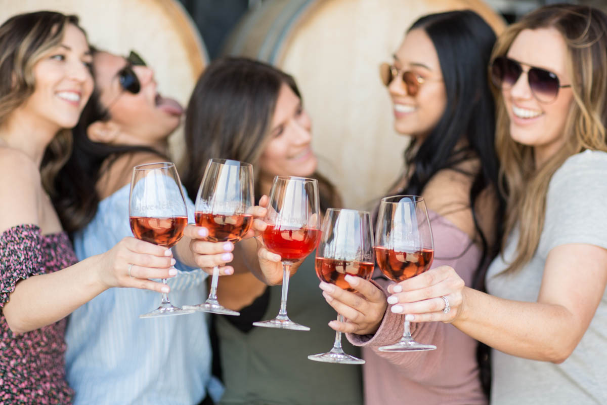 Friends enjoying a wine tasting together at a vineyard in Morgan Hill CA