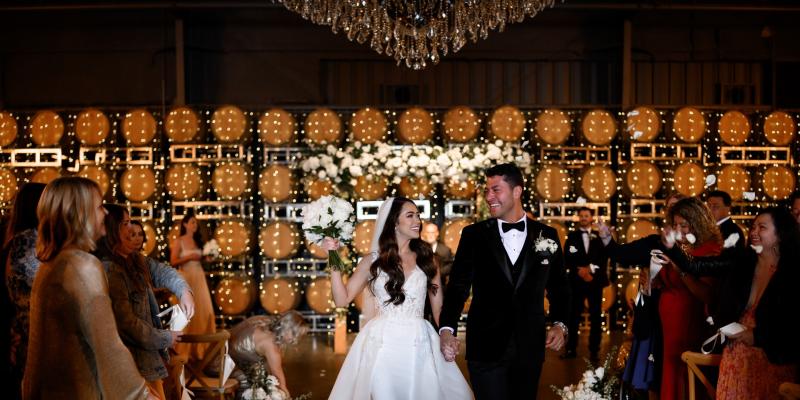 Vineyard wedding celebration at a winery in Hollister CA with elegant decor and guests celebrating the couple