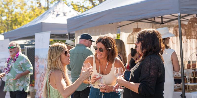 Women holding glasses of wine