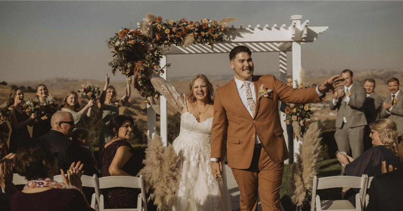 Autumn vineyard wedding ceremony at Léal Vineyards with seasonal floral décor