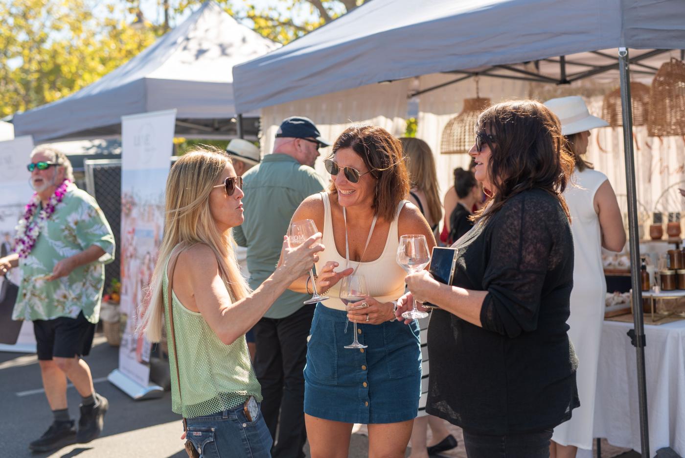 Women holding glasses of wine