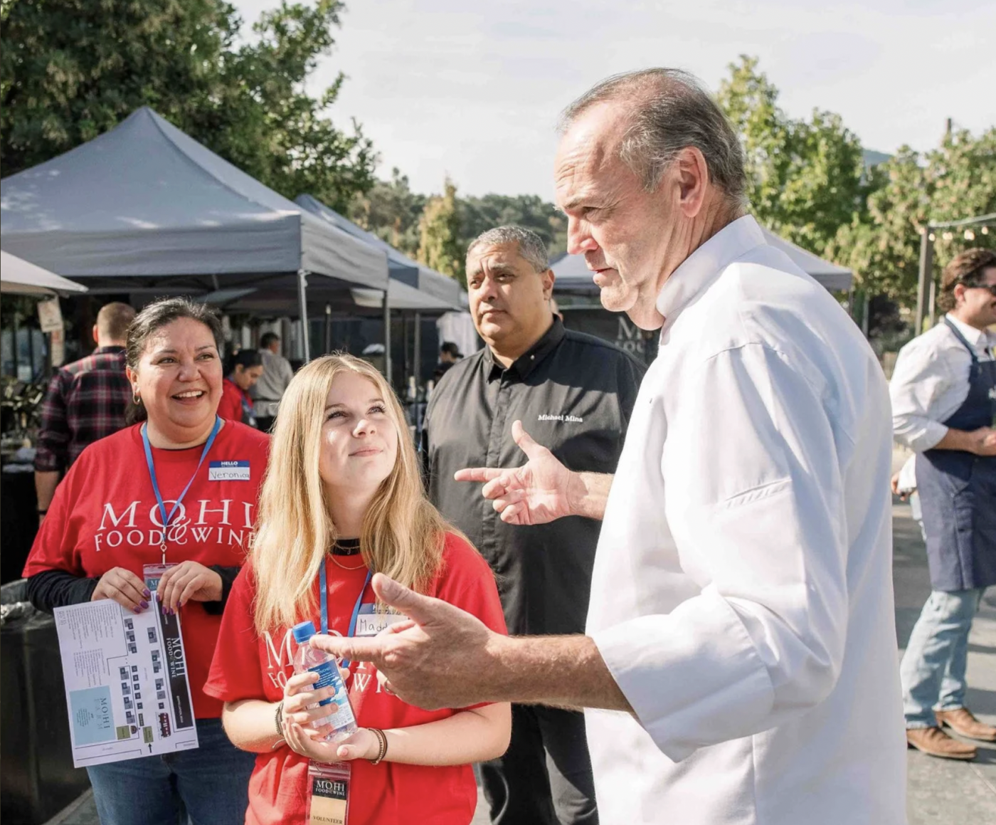 Chef Charlie Palmer serving food at the MOHI Food and Wine festival
